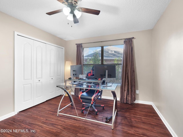 office area featuring a textured ceiling, ceiling fan, and dark hardwood / wood-style floors