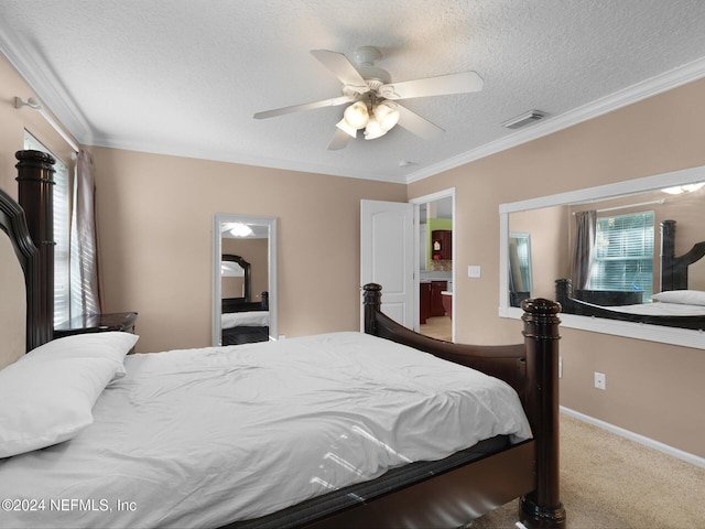 bedroom featuring a textured ceiling, carpet floors, ceiling fan, and crown molding