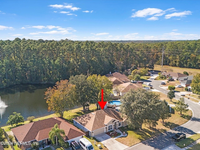 birds eye view of property with a water view