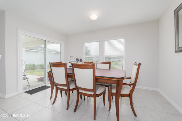 dining room featuring light tile patterned flooring