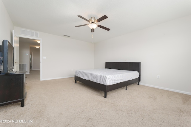 bedroom with light colored carpet and ceiling fan