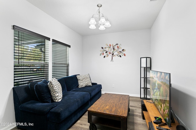 living room with a chandelier and wood-type flooring