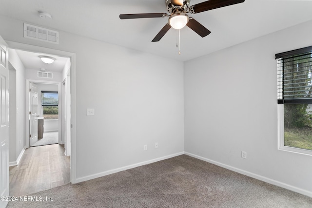 unfurnished room featuring carpet and ceiling fan