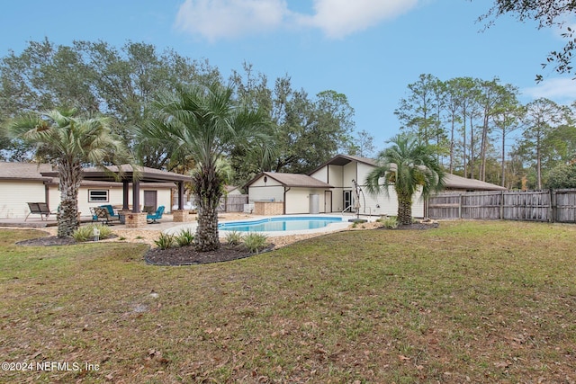 view of yard featuring a fenced in pool and a patio area