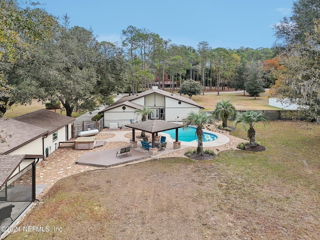 view of swimming pool featuring a yard and a patio area