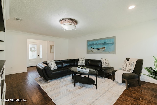 living room featuring ornamental molding, a textured ceiling, and hardwood / wood-style flooring