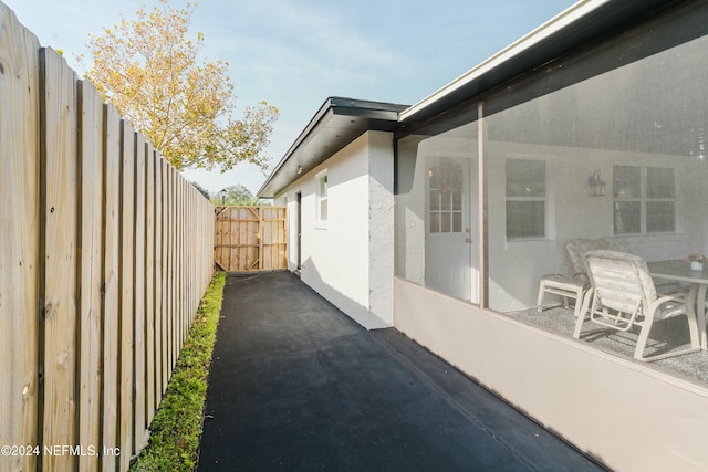 view of side of property with a patio area