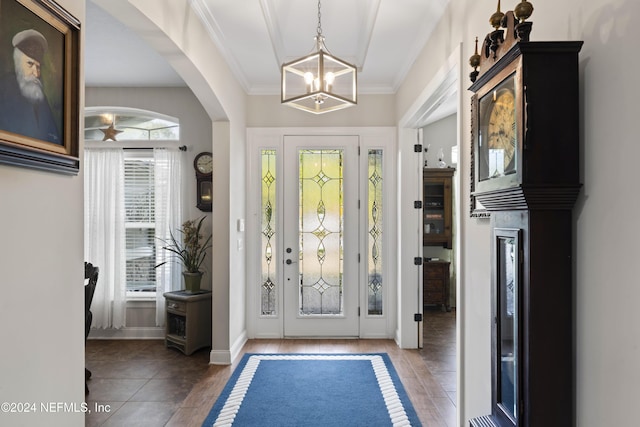 5321 Muskogean St, Saint Augustine, FL 32092 - entryway with a chandelier, arched walkways, and ornamental molding