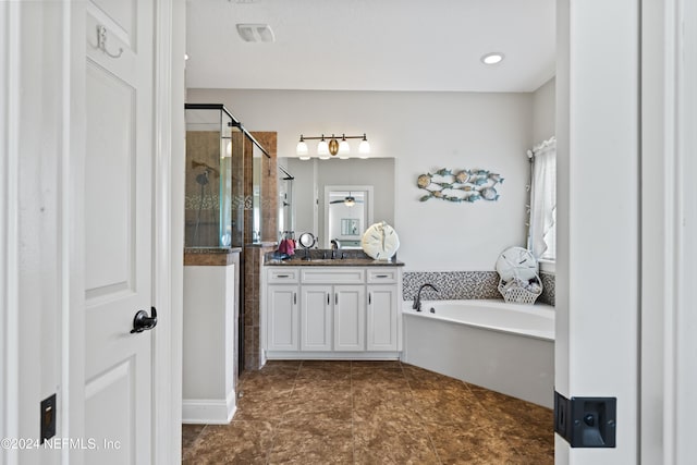 5321 Muskogean St, Saint Augustine, FL 32092 - bathroom featuring vanity, a shower stall, and a garden tub