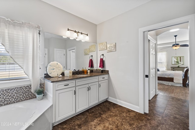 5321 Muskogean St, Saint Augustine, FL 32092 - bathroom featuring vanity, plenty of natural light, a ceiling fan, and a bath