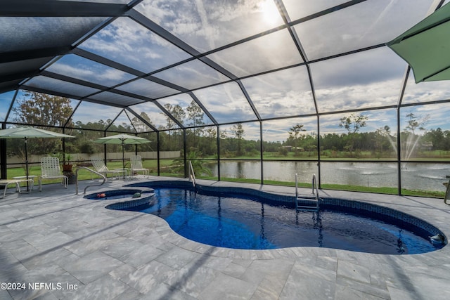 5321 Muskogean St, Saint Augustine, FL 32092 - view of swimming pool with a water view, a patio area, a pool with connected hot tub, and glass enclosure