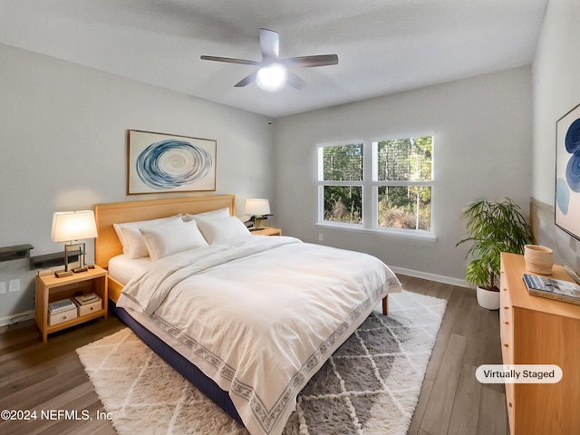 bedroom featuring dark hardwood / wood-style floors and ceiling fan