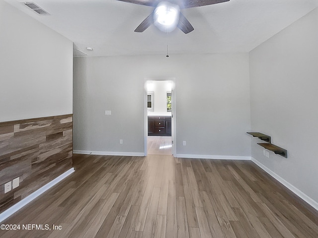 unfurnished living room with hardwood / wood-style floors and ceiling fan