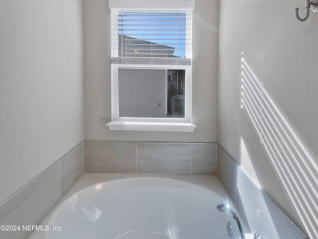 bathroom featuring a washtub