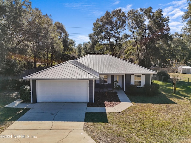 ranch-style house with a front yard and a garage