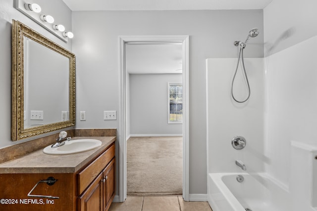 bathroom featuring tile patterned flooring, vanity, and shower / tub combination