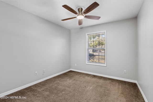 carpeted empty room with ceiling fan