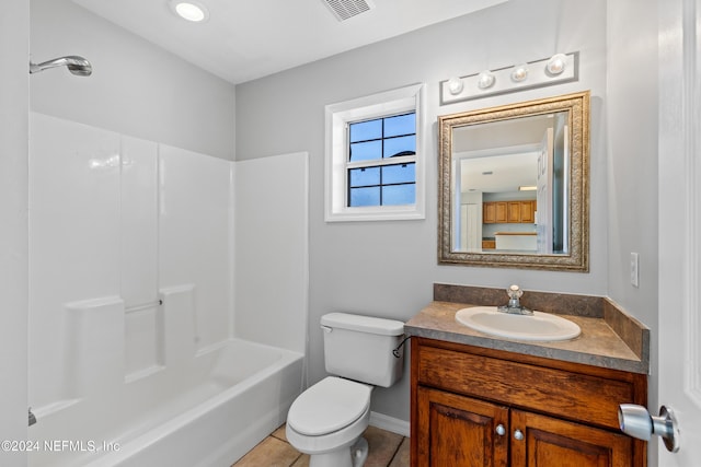 full bathroom featuring tile patterned flooring, bathtub / shower combination, vanity, and toilet