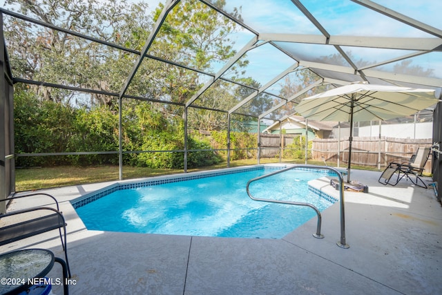 view of pool featuring a lanai and a patio area