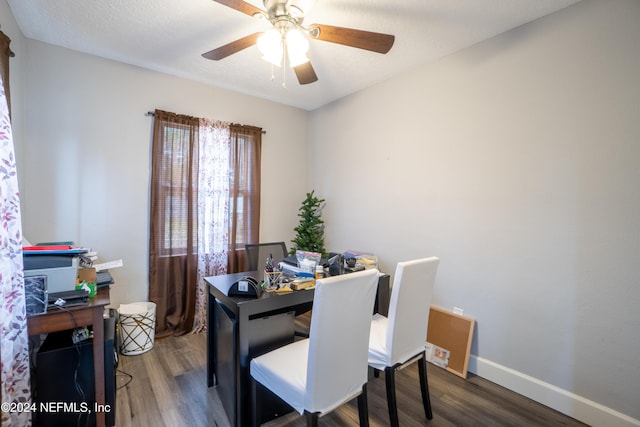 dining space featuring ceiling fan, wood-type flooring, and a textured ceiling