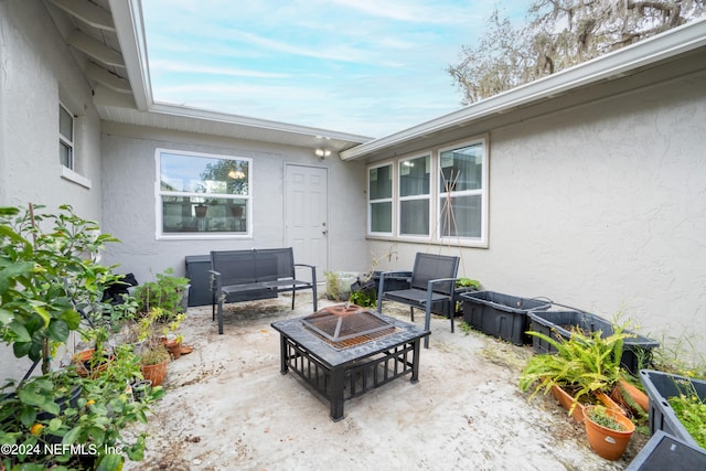 view of patio with a fire pit