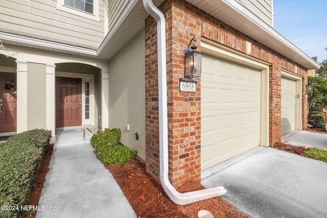 property entrance featuring a garage