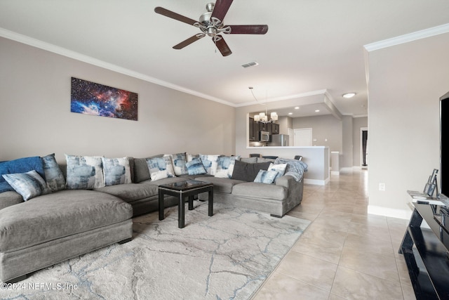 living room with ceiling fan with notable chandelier, ornamental molding, and light tile patterned flooring