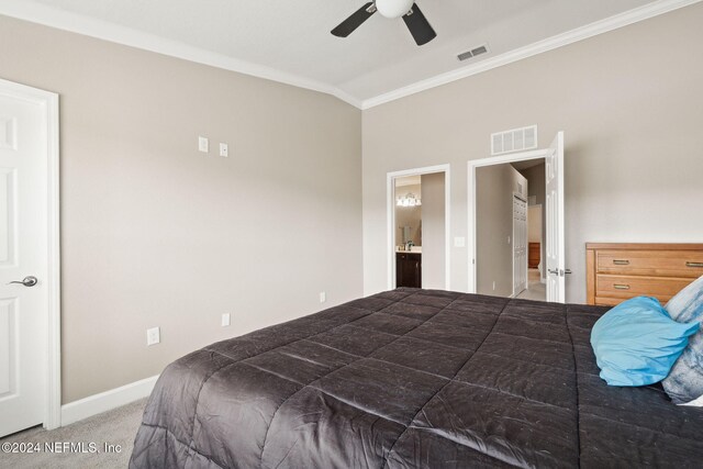 bedroom with ceiling fan, crown molding, carpet floors, and lofted ceiling