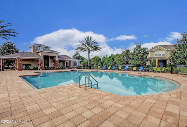 view of pool featuring a patio