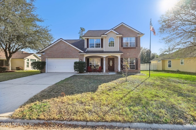 view of front facade with a front yard, a porch, and a garage