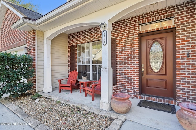 property entrance featuring a porch