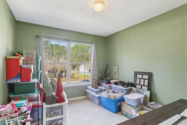 interior space with a textured ceiling and carpet floors