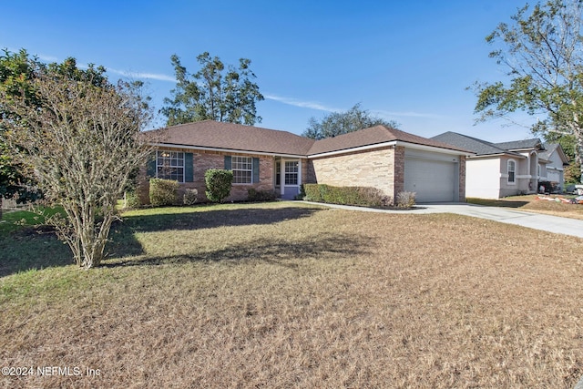 ranch-style home with a front yard and a garage