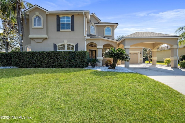 view of front of property with a front yard and a garage