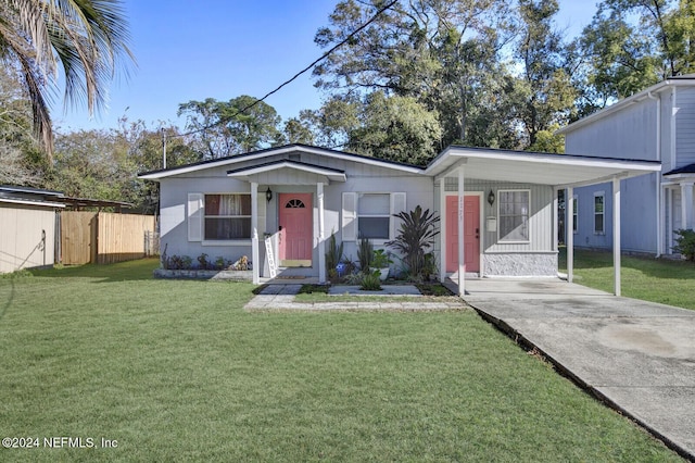 bungalow-style home with a carport and a front yard