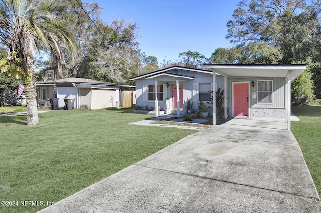 view of front of home with a shed and a front lawn