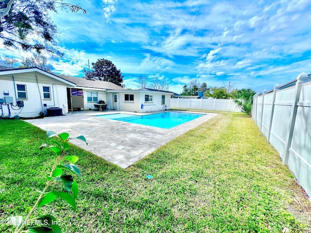 view of pool featuring a yard and a patio area