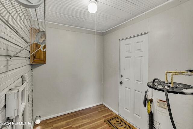 entryway with water heater and light hardwood / wood-style floors