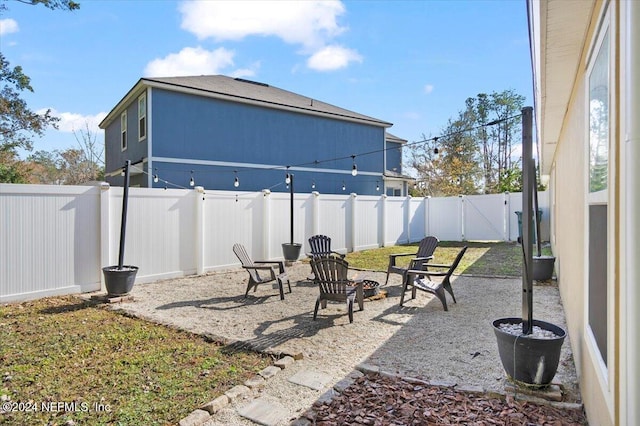 view of patio with an outdoor fire pit