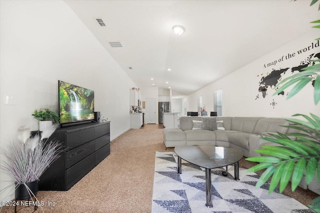 living room with light colored carpet and lofted ceiling