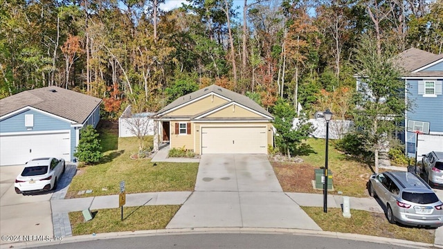 view of front property featuring a garage and a front yard