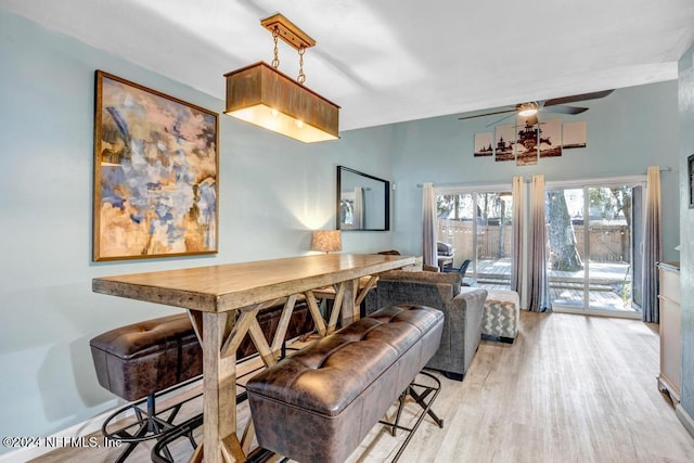 dining area featuring ceiling fan and light hardwood / wood-style flooring