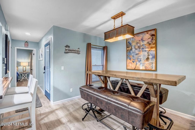 dining space with light wood-type flooring