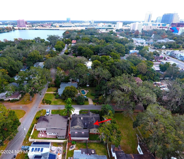 birds eye view of property with a water view