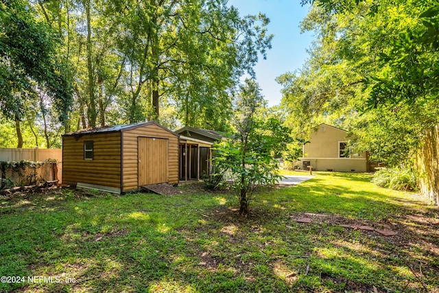 view of yard with a patio and a shed