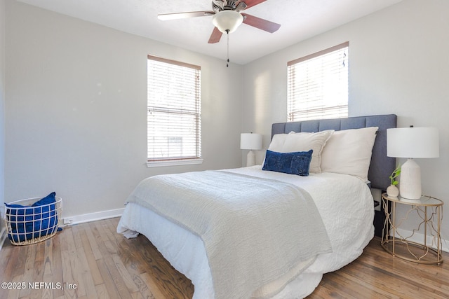 bedroom featuring hardwood / wood-style flooring and ceiling fan