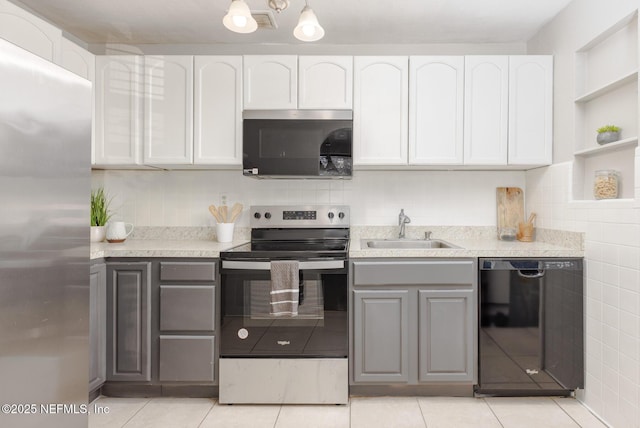 kitchen with white cabinets, gray cabinetry, sink, and appliances with stainless steel finishes