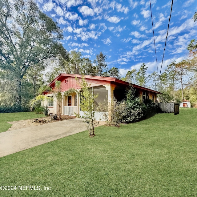 mediterranean / spanish home with a front yard