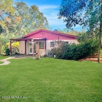 exterior space featuring a yard