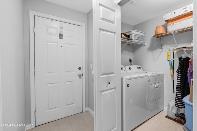 8550 Touchton Rd Unit 1226, Jacksonville, FL 32216 - laundry area featuring light tile patterned floors and separate washer and dryer